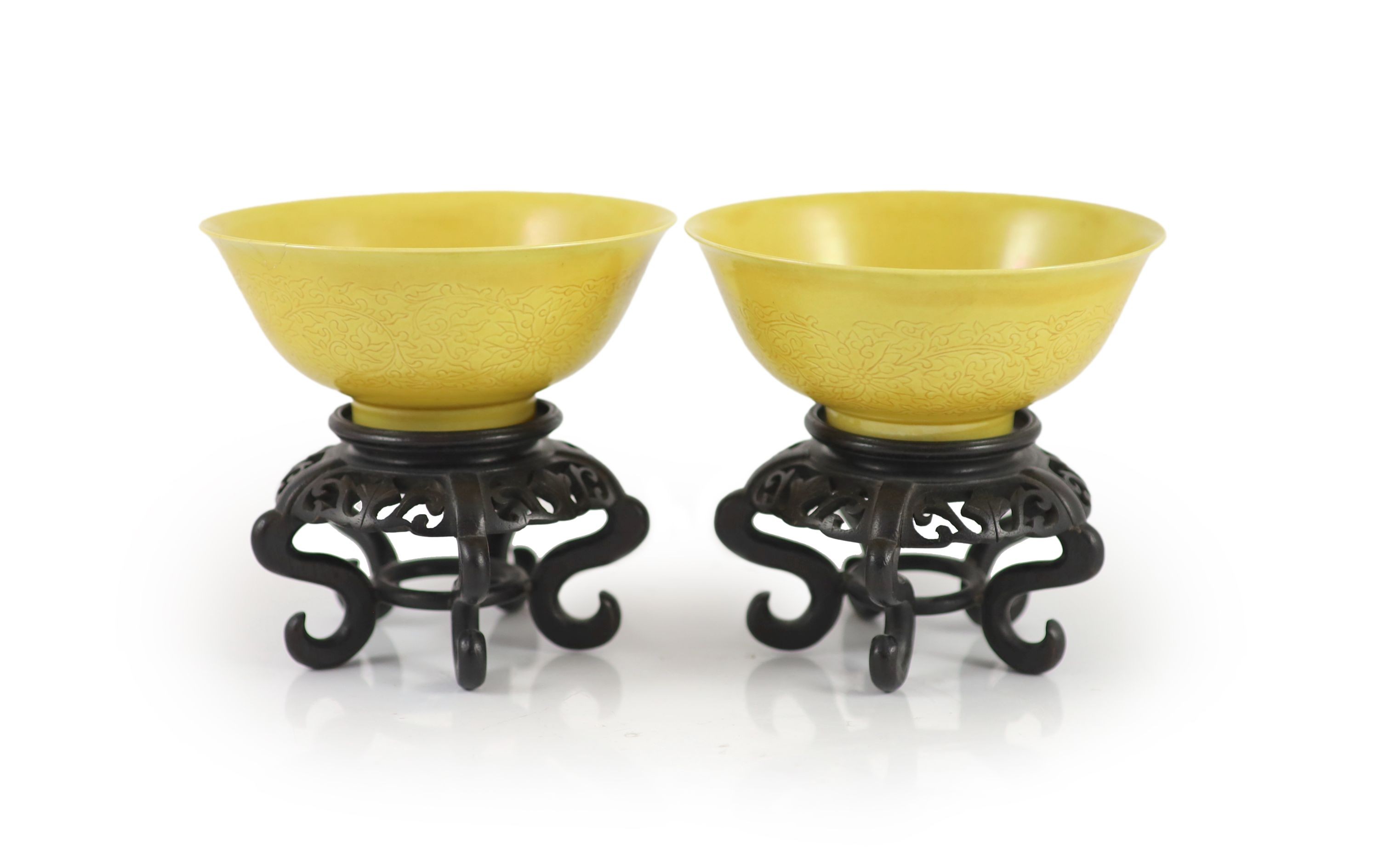 A pair of Chinese yellow ground sgraffito bowls, Kangxi mark but mid 20th century,